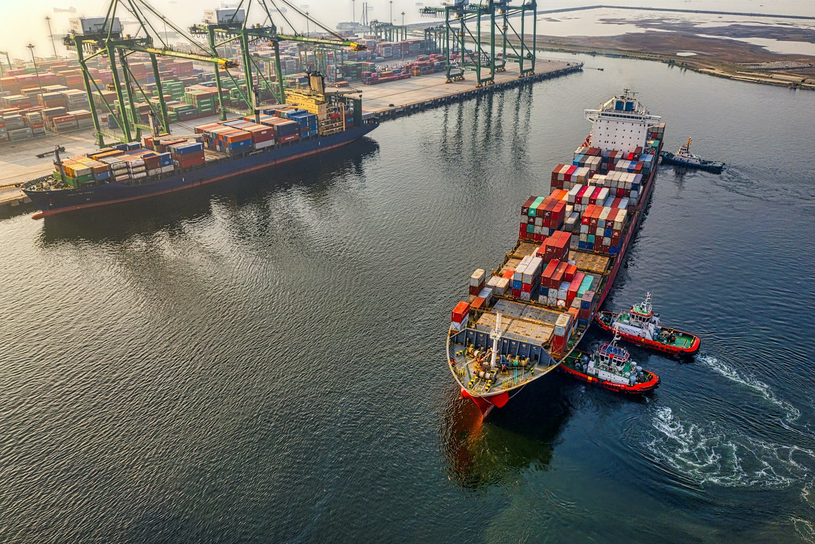Aerial view of a container ship carrying export cargo across the ocean